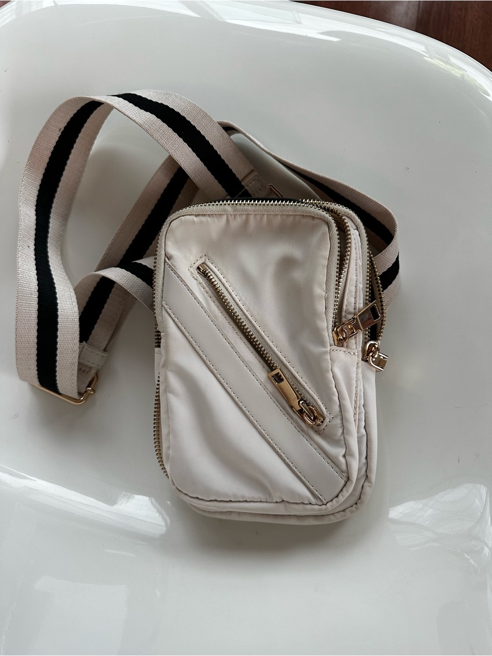 Versatile Cream Crossbody Travel Bag with Striped Strap